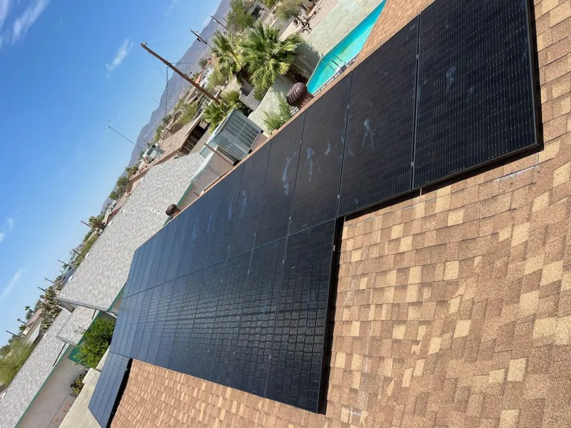 Solar panels installed on shingle roof home with pool - residential solar installation